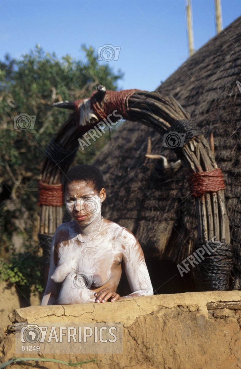 AFRIPICS - A bare breasted trainee Sangoma covered in white clay